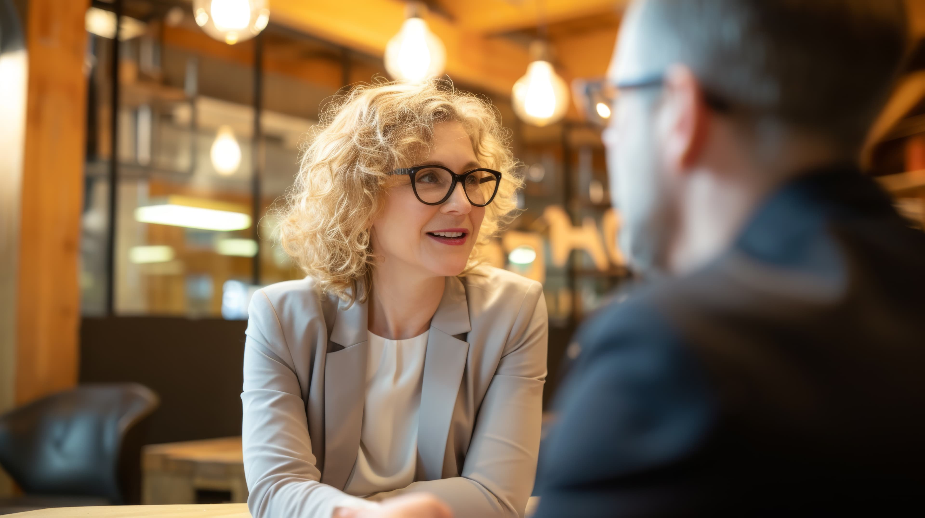 Eye care professional talking with a patient about lens options